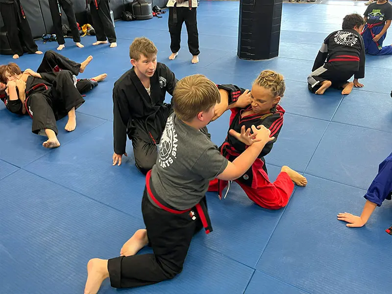 kids in Erlanger martial arts class improving focus, discipline, and listening skills through martial arts training
