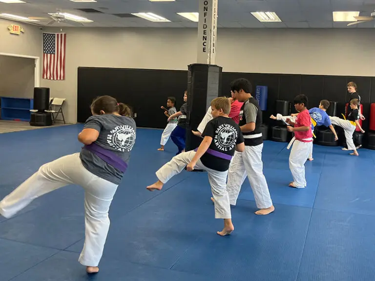 Teen in Erlanger martial arts class improving focus, discipline, and listening skills through martial arts training
